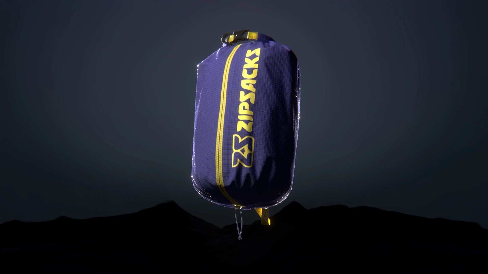 An indigo Zipsacks dry bag with a yellow zipper, floating above dark hills.